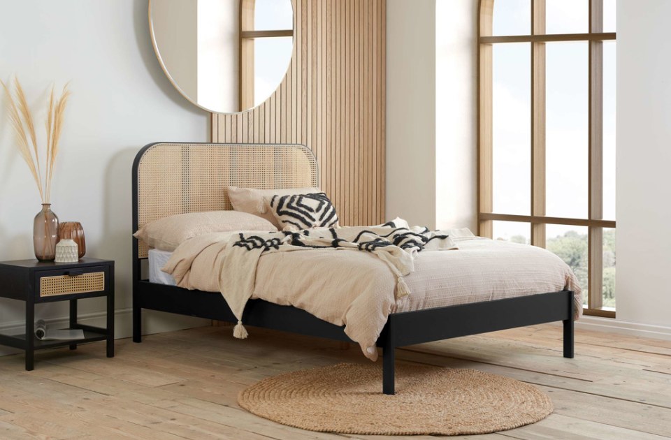 Bardot Rattan Black Bed Frame in a bedroom