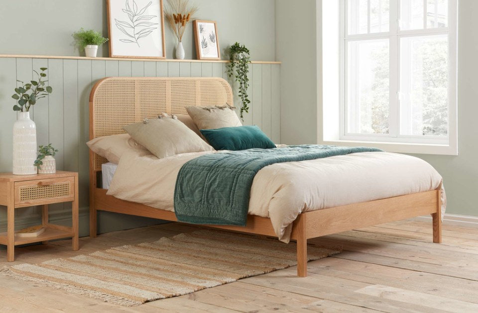 Bardot Rattan Oak Bed Frame in a bedroom