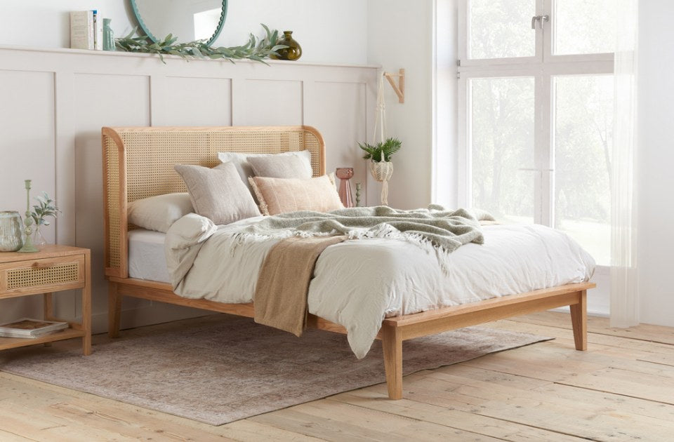 Berkshire Rattan Oak Bed Frame in a bedroom