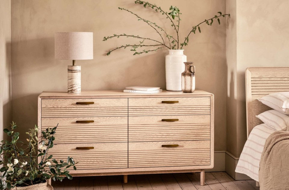 Harlem Oak 6 Drawer Chest in a bedroom