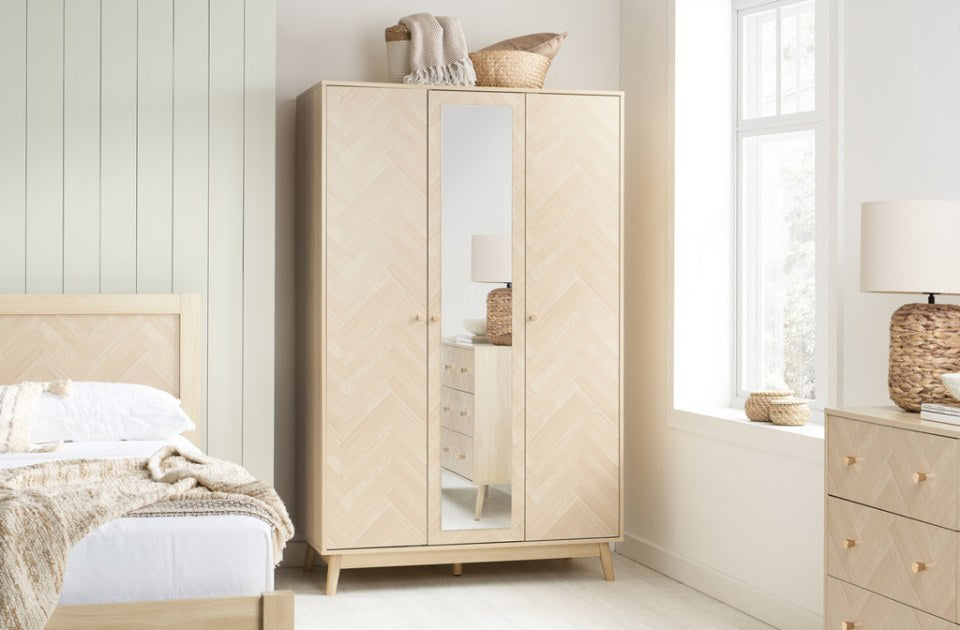 Hemmingway Oak 3 Door Wardrobe With Mirror in a bedroom