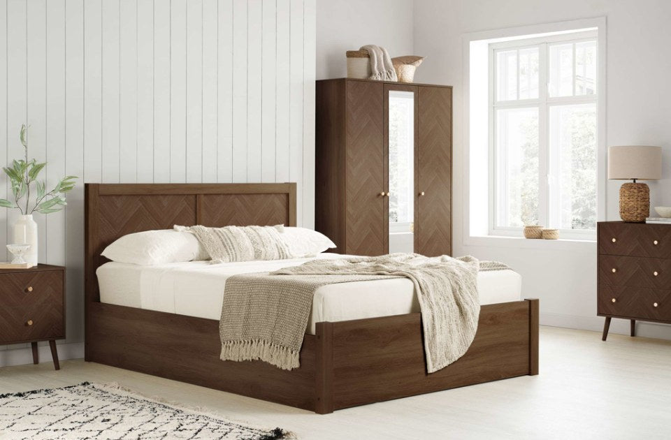 Hemmingway Walnut Ottoman Bed in a bedroom