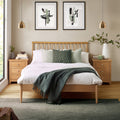 Label Solid Oak Spindle Double Bed Frame in a bedroom
