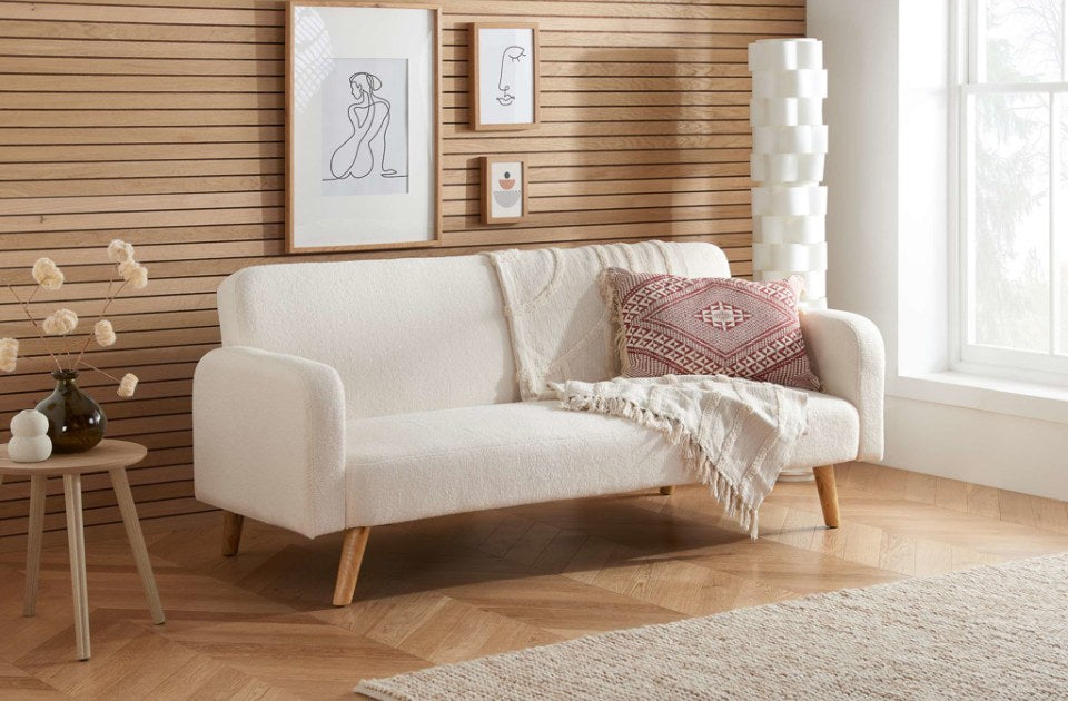 Michelle Sofa Bed Boucle White in a living room
