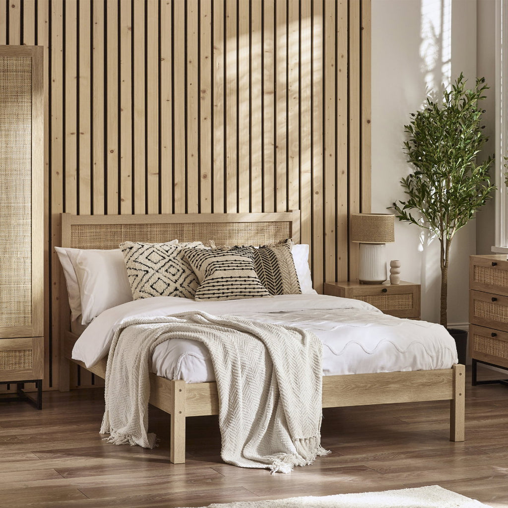 Paddy Oak Rattan Double Bed Frame in a bedroom