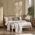 Paddy Oak Rattan King Size Bed Frame in a bedroom