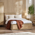 Paddy Oak Rattan King Size Ottoman Bed in a bedroom